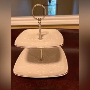 Two-tier server in white porcelain with snowflake raised design and silver trim.